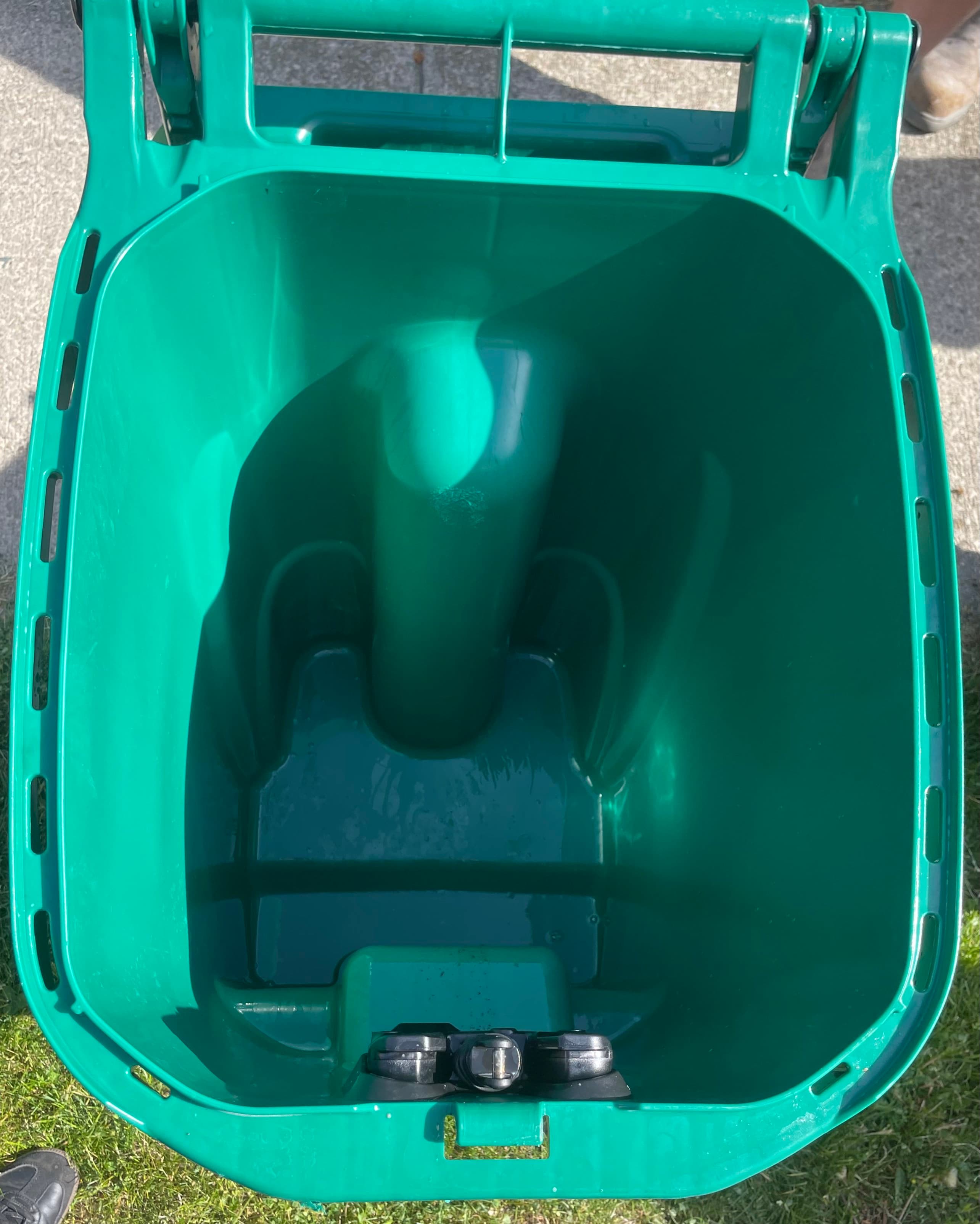 Clean green garbage can after cleaning